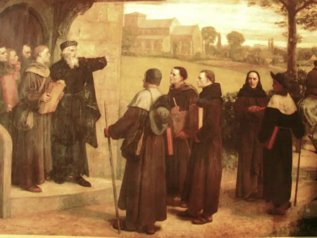 Le théologien anglais John Wyclif donnant sa version de la Bible et de la foi aux Lollards, des membres d'un groupe religieux adhérant aux principes avancés par le savant ; par le peintre W-F. YEAMES (1835-1918 ) I Domaine public